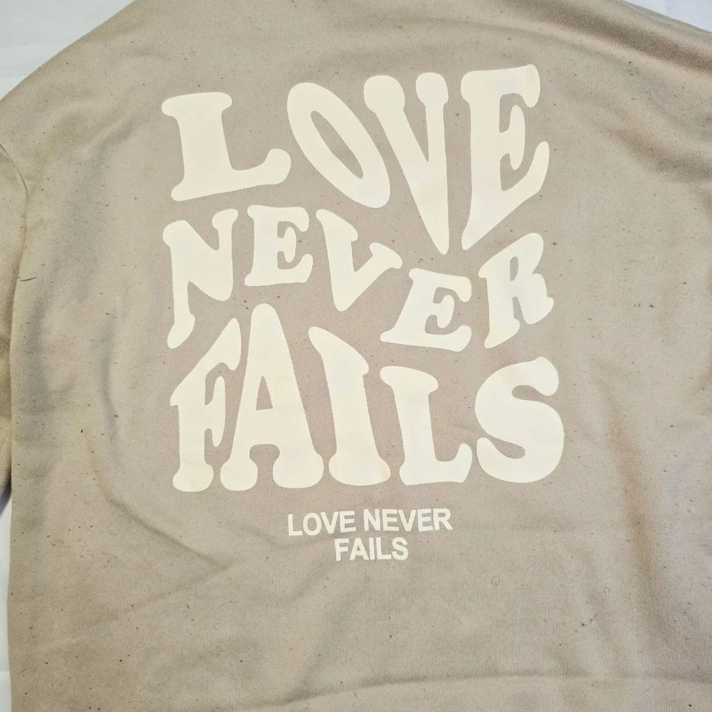 Men's Love Never Fails Fleece Hoodie Size M Beige Distressed Raw Hem T3